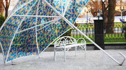 Bench under the umbrella Stock Photos