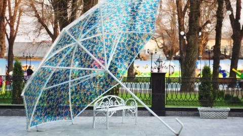 Bench under the umbrella Stock Photos