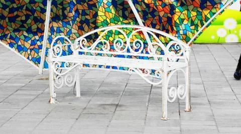 Bench under the umbrella Stock Photos