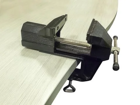 Bench vice on table Stock Photos