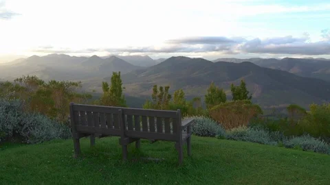 Bench at a view point overlooking a picturesque landscape Stock Footage 89774453