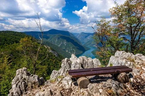 A bench at the viewpoint with a view of the lake Stock Photos