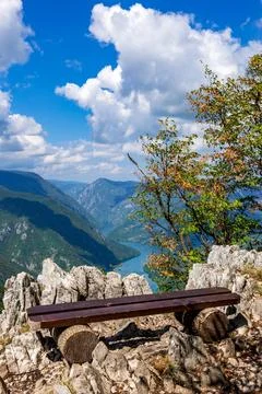 A bench at the viewpoint with a view of the river canyon Stock Photos