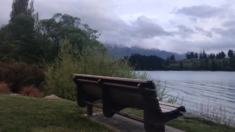 Bench at Wakatipu Lake in New Zealand Stock Footage