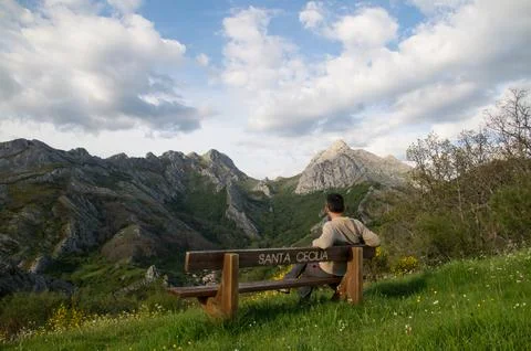 On the bench watching the mountains Stock Photos