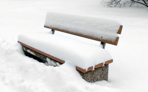 Bench in winter park Stock Photos
