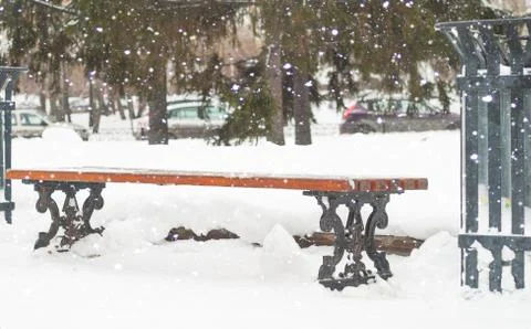 Bench in winter park Stock Photos