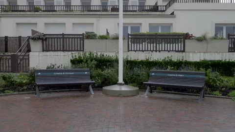 Benches named in the seafront of CABOURG beach. Video 4K Stock Footage 256885205