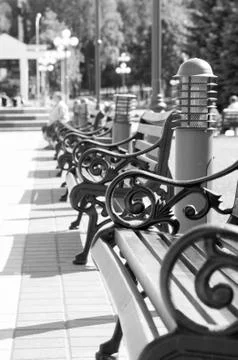Benches stand in a row Stock Photos