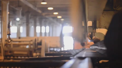 Bend steel create a metallic pole. Two workers bending sheet metal with a large Stock Footage 57513336