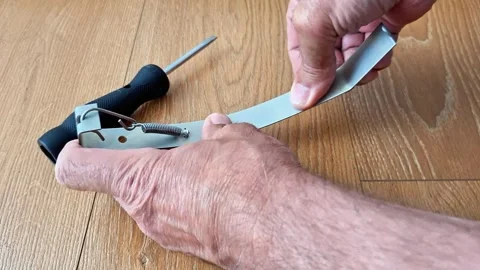 Bending a Metal Plate with a Spring Clamp for Precision Alignment Stock Footage 340541035