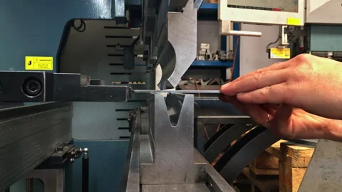 Bending sheet metal with a hydraulic machine at the factory Stock Footage 167142957