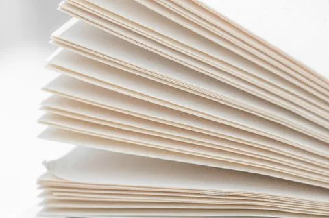 Bending stack of paper sheets, open magazine with copy space. Foto stock