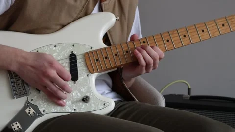 Bending strings on an electric guitar Stock Footage 333388593