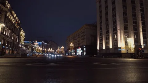 Bendy bus passes the intersection. background night city, majestic architecture Video stock 104715278