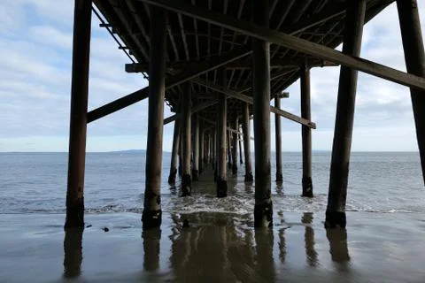 Beneath an ocean pier Stock Photos