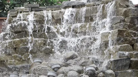 Beneath the Rocks - A Journey Through the Waves of a Waterfall Stock Footage 318338976