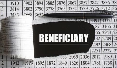 BENEFICIARY is the word behind torn office paper with numbers and a black pen Stock Photos