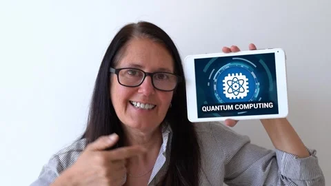 Benefits of quantum computing concept. Woman holding up a tablet with quantum Stock Footage 305645248
