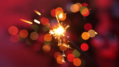 Bengal fire on the background of flashing lights of the new year Stock Footage 166177969
