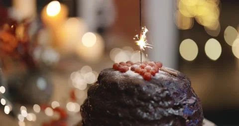 Bengal fire burning on a chocolate pie Stock Footage 145983777