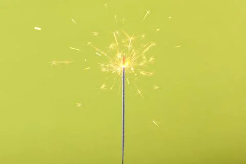 Bengal fire on a colored background. Stock-Fotos