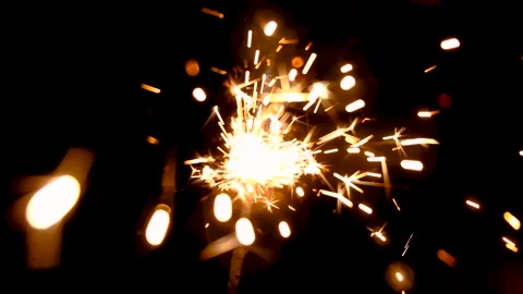 Bengal fire. New year sparkler candle on a black background Stock Footage 143376481