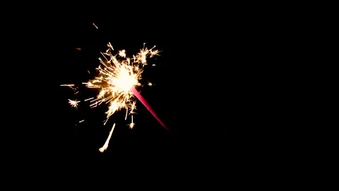 Bengal fire. New year sparkler candle on a black background Stock Footage 145446102