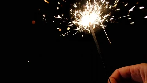 Bengal fire. New year sparkler candle on a black background. Holiday party Stock Footage 162213764