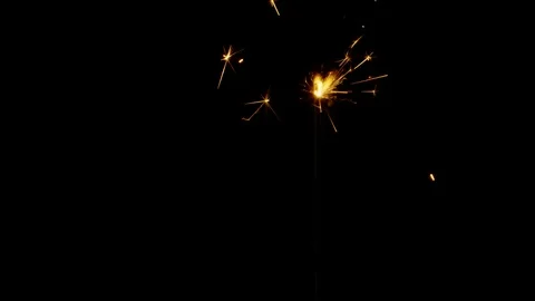 Bengal fire sparkle burning in the dark on black backdrop 4k super slow motion Stock-Footage 126493838