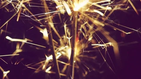 Bengal light burning with bright sparkles on black background Video stock 81511492