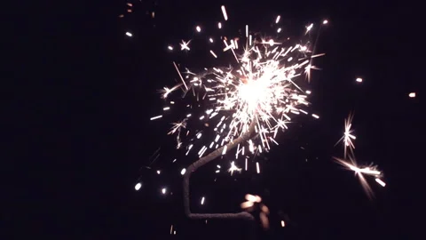 Bengal light in shape of digit two with sparkles in slow motion Video stock 146190168