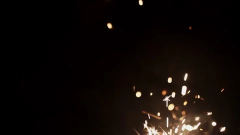 Bengal light sparking on black background Stock Footage 293789685