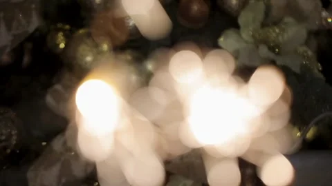 Bengal lights are sparkling in front of decorated christmas tree. Stock Footage 251529432