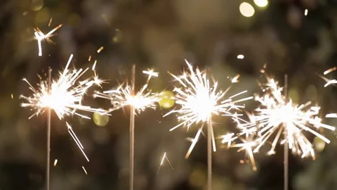 Bengal lights are sparkling in front of christmas tree. Stock Footage 251529578