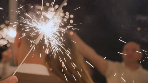 Bengal lights burning in a persons hand Stock Footage 329094629