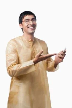 Bengali man text messaging on a mobile phone Stock Photos