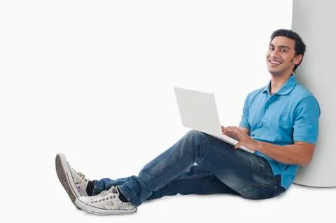 Bengali man using a laptop Фото