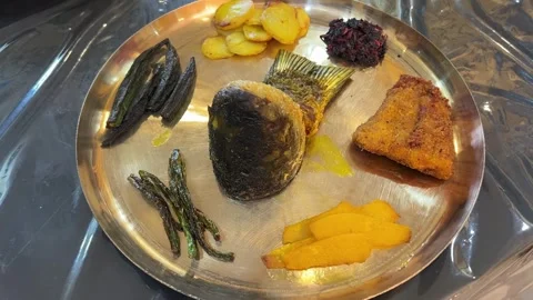 Bengali thali with fish and  vegetables served in rice ceremony Stock Footage 316864112