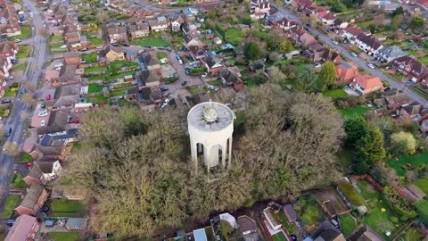 Bengeo water tower drone pullback rising reveal over suburban Hertfordshire Stock Footage 331689900
