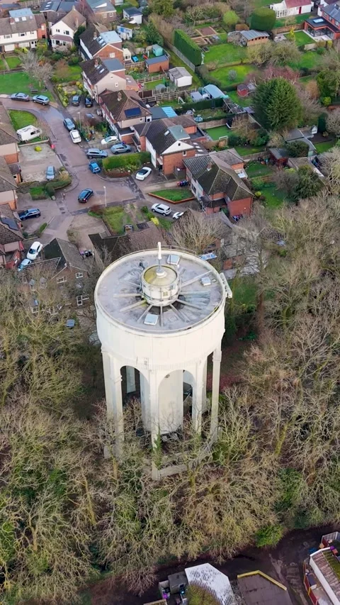 Bengeo water tower vertical drone pullback rising reveal over suburban Stock Footage 331689355