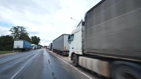 Beniakoni, Belarus - August 31, 2024: Tanker truck overtaking a long line of Stock Footage 319050020