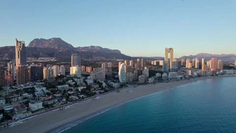 Benidorm Playa de Poniente beach at sunset with tall buildings. Stock Footage 232877313