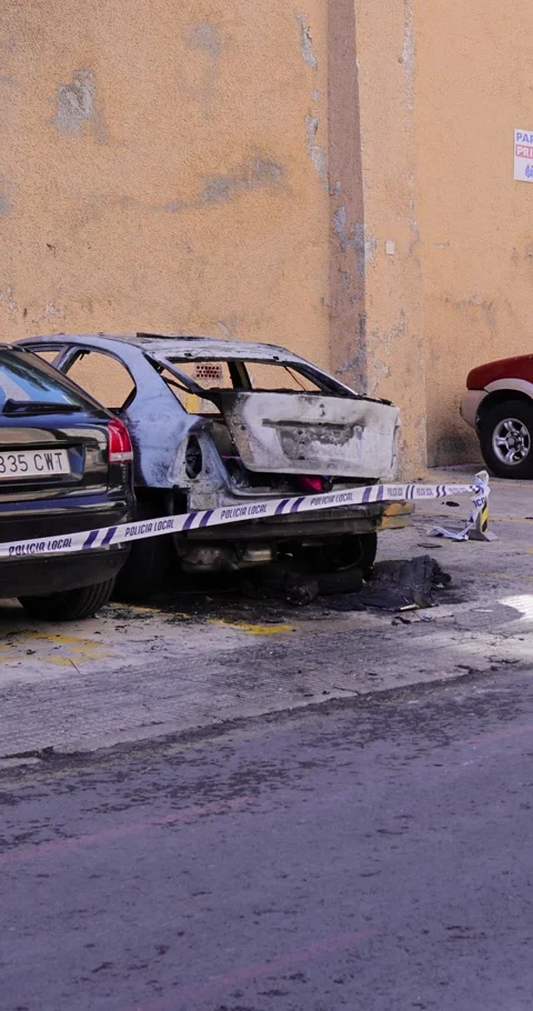 Benidorm Spain, 11th April 2024: Portrait footage of a burnt out car outsid.. Stock Footage 274353374
