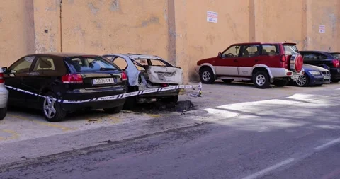 Benidorm Spain, 11th April 2024: Footage of a burnt out car outside a hotel.. Stock Footage 274354019