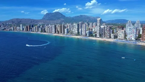 Benidorm in Spain flight by drone over the sea beach and scyscrappers Stock Footage 214374578