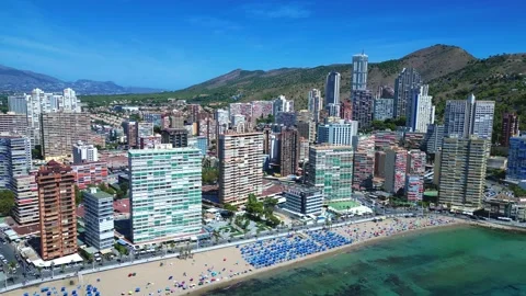 Benidorm in Spain flight by drone over the sea beach and scyscrappers Stock Footage 214375197