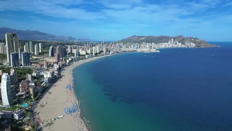 Benidorm in Spain flight by drone over the sea beach and scyscrappers Stock Footage 214378470
