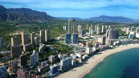 Benidorm in Spain  flight by drone over the sea beach and scyscrappers Stock Footage 214385175