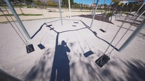 Benidorm,Alicante,Spain.2026-02-19.Empty Swing Set in Sunny Benidorm Park Stock Footage 329609139